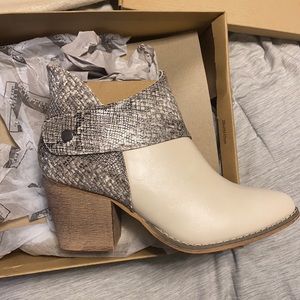 Never worn booties. Two toned. Snake skin print and eggshell. Wooden heal